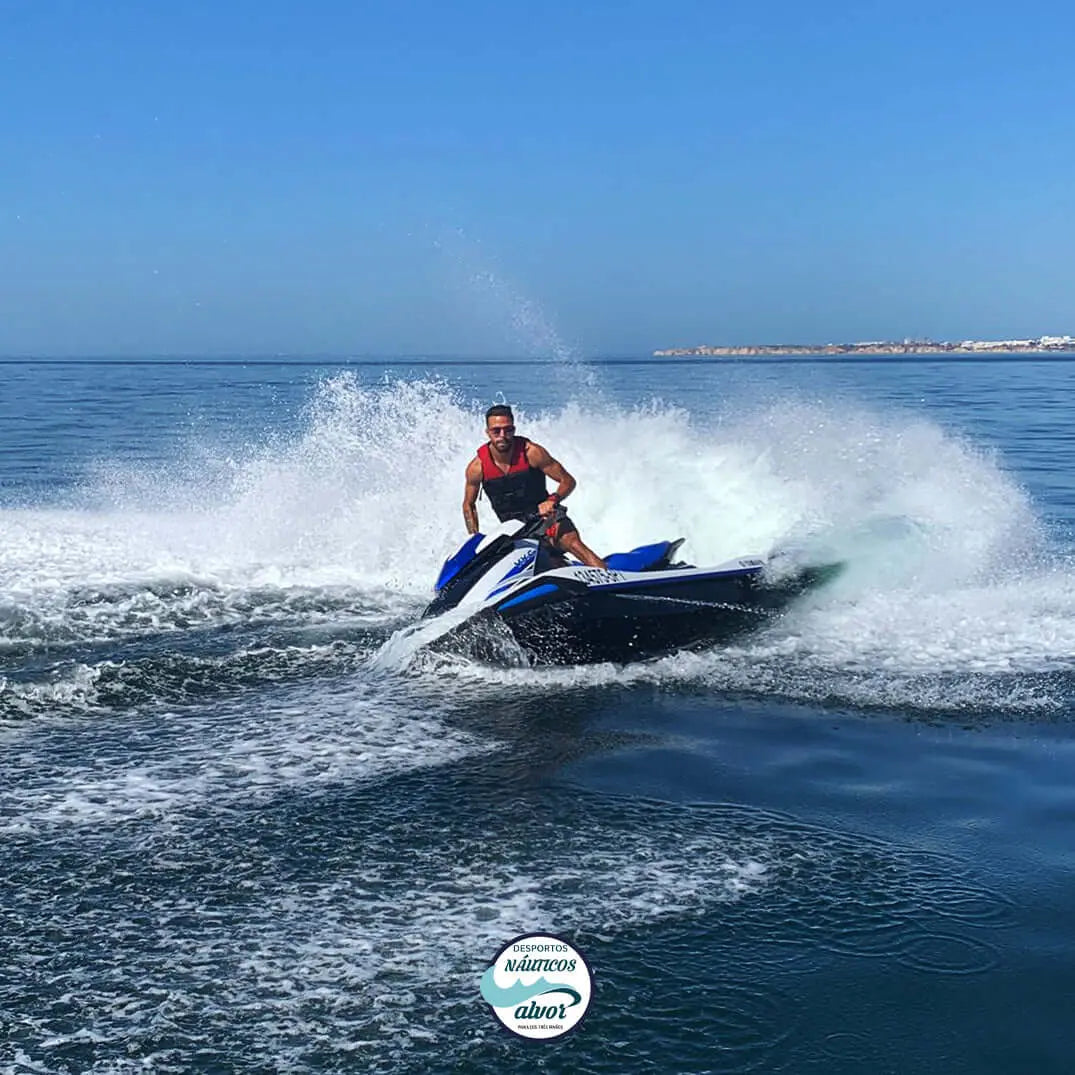 Person on a jetski on the clear waters of Alvor, showcasing thrilling water fun.