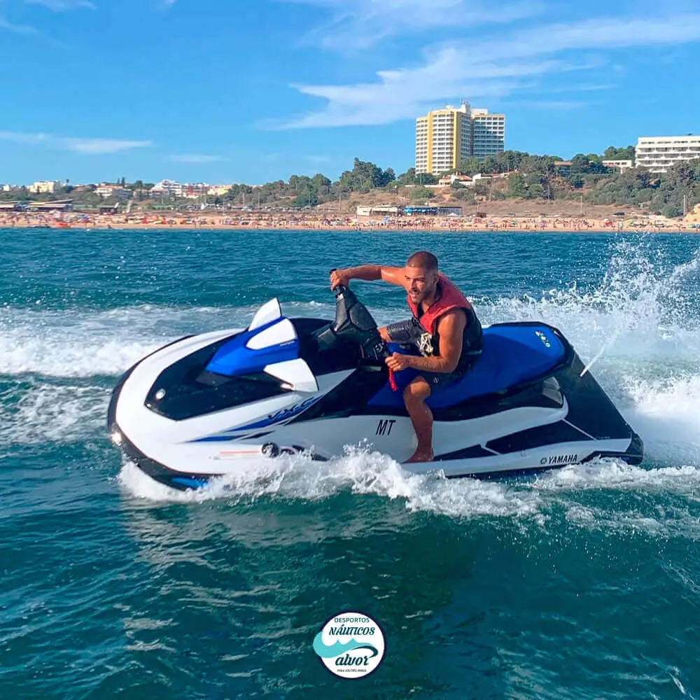 Person on a jetski on the clear waters of Alvor, showcasing thrilling water fun.