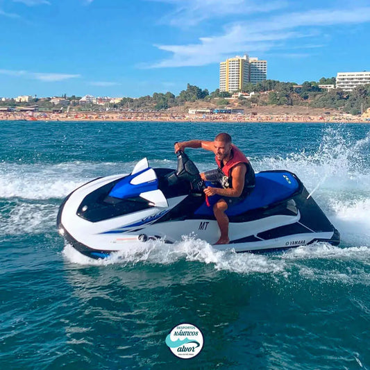 Person on a jetski on the clear waters of Alvor, showcasing thrilling water fun.